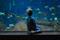 Child visiting an aquarium